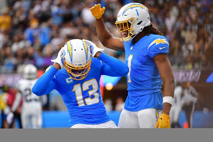 Oct 1, 2023; Inglewood, California, USA; Los Angeles Chargers wide receiver Keenan Allen (13) celebrates his touchdown scored against the Las Vegas Raiders with wide receiver Quentin Johnston (1) during the first half at SoFi Stadium. Mandatory Credit: Gary A. Vasquez-USA TODAY Sports